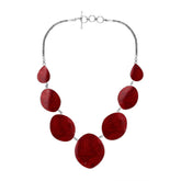 Women’s sterling silver necklace with oval and teardrop coral stones and Bali-inspired accents.